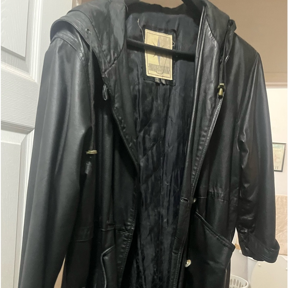 Women’s black maxi leather coat size large.Coat is 15 years old.